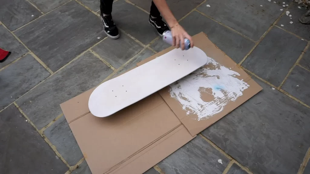 Apply an aerosol primer or hand primer on your skateboard